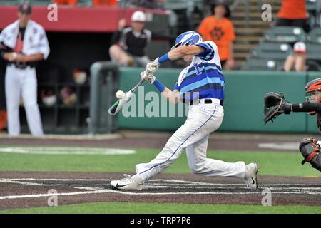 Hitter making solid contact that resulted in a double play that also drove in a run. USA. Stock Photo