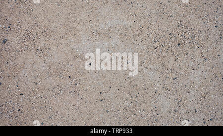 Texture of sandy ground with small pebbles. Stock Photo