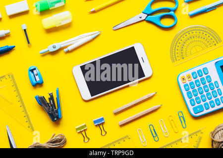 Mock up blank screen mobile phone for back to school background concept. School items background with copy space, top view flat lay background. Stock Photo