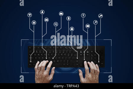 Hand typing on computer keyboard with application programming interface icons Stock Photo