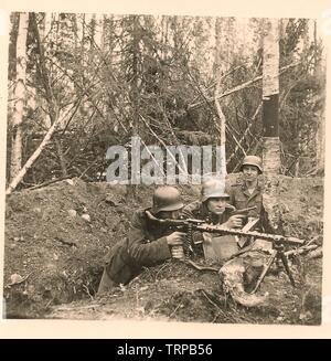 German Soldiers of the 6th SS Mountain Division Nord dressed in ...