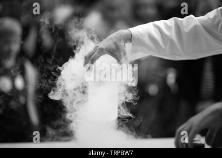 Chemical container with steaming liquid Stock Photo