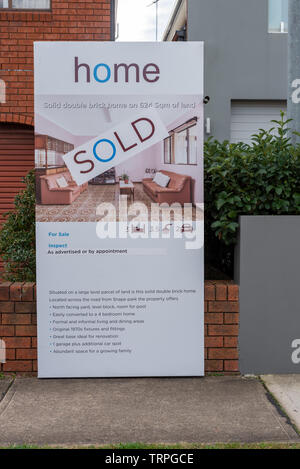 Australian property for sale signs with a sold sticker on it Stock Photo