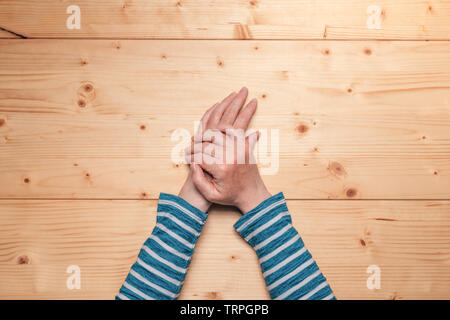 Female hands on the table, top view with copy space Stock Photo