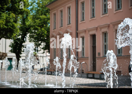 water fountain in front of a classicistic mansion Stock Photo