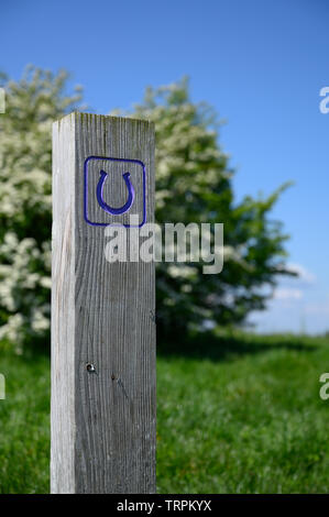 A wooden footpath and bridle path sign at Mam Tor, Castleton ...