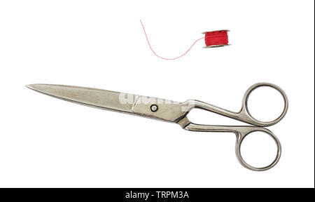 Old vintage scissors and a spool isolated on white Stock Photo
