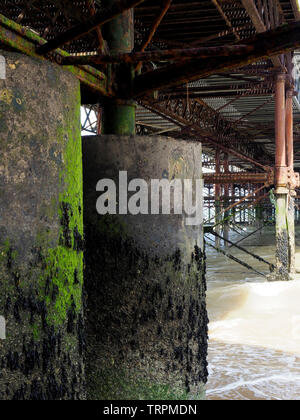 The view underneath the famous Cromer Pier in Norfolk showing the complex steel and concrete structure. Stock Photo