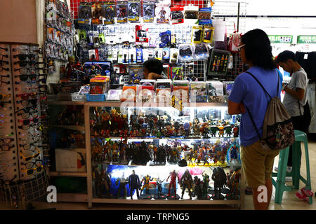 ANTIPOLO CITY, PHILIPPINES – JUNE 7, 2019: Assorted collectible toys and computer video games on display at a store. Stock Photo