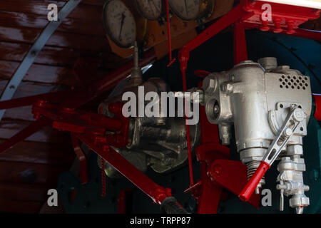 Closeup control valve of steam locomotive. Directional valves allow steam to flow through the steam locomotive engine drive system. Railway transport Stock Photo