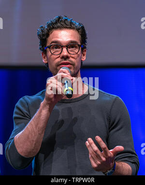 Bonn, Germany - June 8 2019: Steven Strait (*1986, American actor and model - The Expanse) talks about his experiences in The Expanse at FedCon 28 Stock Photo