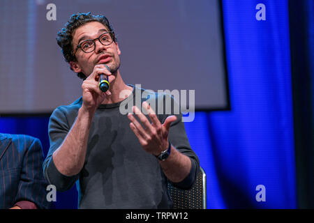 Bonn, Germany - June 8 2019: Steven Strait (*1986, American actor and model - The Expanse) talks about his experiences in The Expanse at FedCon 28 Stock Photo