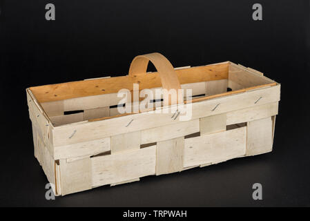 Empty wooden basket isolated on a black background Stock Photo