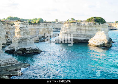 View of the Faraglioni of Sant Andrea in Salento near Otranto, majestic rocks a few meters from the coast of southern Italy. Stock Photo