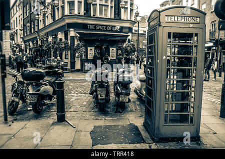 Telephone cabin in front of 'The Spice of Life', London, UK Stock Photo