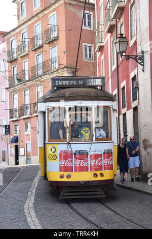 28E tram, much used by tourists, Largo das Portas do Sol, Lisbon, Portugal, June 2019 Stock Photo