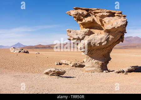 A side view of the Stone Tree (Arbol de Piedra), an isolated rock formation in the Siloli Desert, part of the Altiplano region of Bolivia. Stock Photo