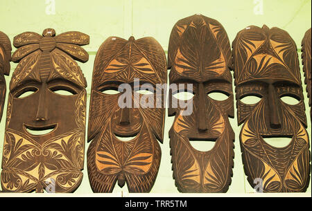 Made in Coron, Palawan, masks of native designs are on sale as island souvenirs are carved and handcrafted by the natives from available wood. Stock Photo