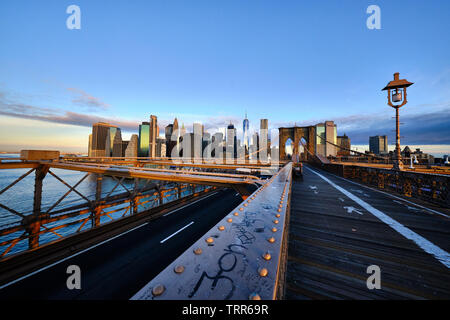 Pictured is the Brooklyn Bridge a hybrid cable-stayed/suspension bridge in New York City, Stock Photo