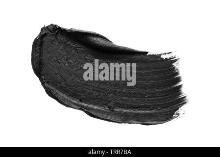 Texture of black crushed eyeliner or black acrylic paint isolated on white background Stock Photo
