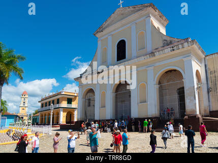 Tourists outside the Church of the Holy Trinity or Iglesia Santisima, Plaza Mayor, Trinidad, Sancti Spiritus Province, Cuba, Caribbean Stock Photo