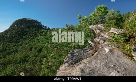 View of main pinnacle (knob) at Pilot Mountain State Park, North Carolina on a clear summer morning. Landscape photography in NC Stock Photo