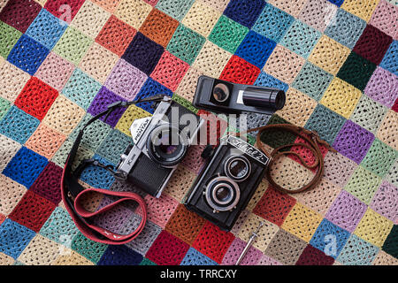 Vintage film cameras on a retro background. Stock Photo