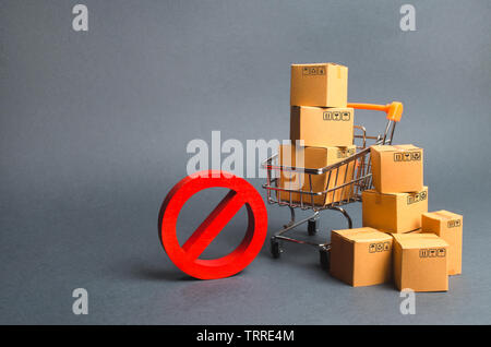 Cardboard boxes, supermarket trolley and red symbol NO. Embargo, trade wars. Restriction on the importation of goods, proprietary for business. Inabil Stock Photo