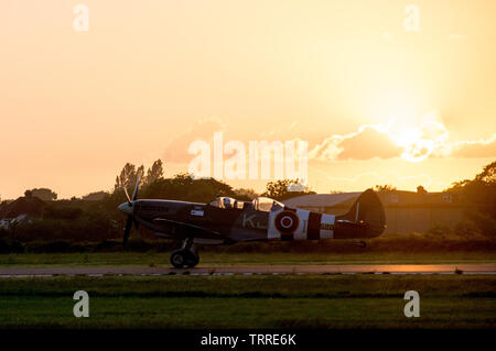 Spitfire SM520  taking off in the sunset Stock Photo