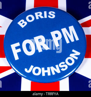 London, UK - June 11th 2019: A badge with Boris Johnson for Prime Minister, pictured over the flag of the UK.  Boris Johnson is one of the contenders Stock Photo