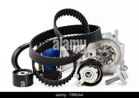 Spare parts for the car. The set of timing belt with rollers and cooling pump on a white background. Stock Photo
