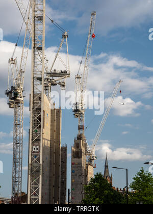 London, England, UK - June 3, 2019: Tower cranes cluster around the concrete core of the new Google UK HQ 'groundscraper' office building in King's Cr Stock Photo