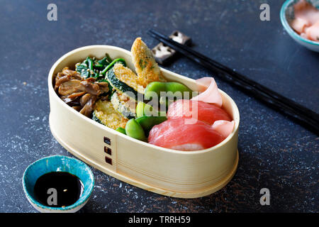 Japanese bento box lunch with sushi and vegetables Stock Photo