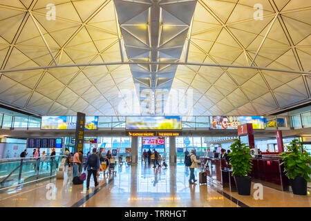 Hong Kong - April 30 2018:  Unidentified people at Hong Kong International Airport where it's the world's busiest cargo gateway and one of the world's Stock Photo