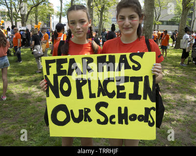 Teens at NYC Solidarity Walk With Gun Violence Survivors at Cadman Plaza in Brooklyn, NY, June 8, 2019. Sign says, 'Fear Has No Place in Our Schools.' Stock Photo