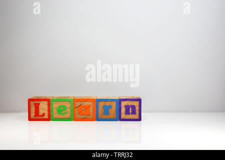 Stylized shot of “Learn” spelled out with ABC blocks. Stock Photo