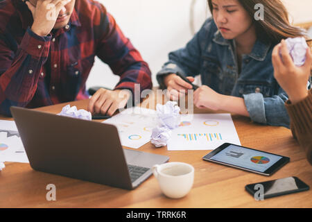 Three businessman get stressed while having a problem in business meeting Stock Photo