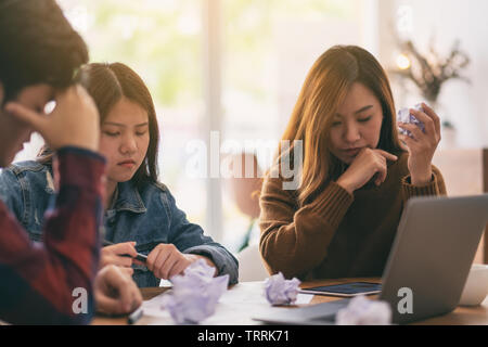 Three businessman get stressed while having a problem in business meeting Stock Photo