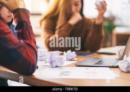 Three businessman get stressed while having a problem in business meeting Stock Photo