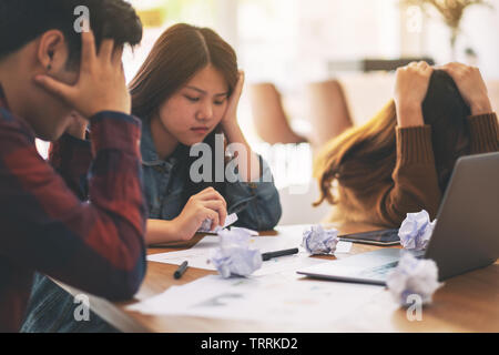 Three businessman get stressed while having a problem in business meeting Stock Photo