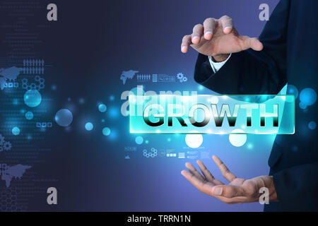 Businessman showing the word growth Stock Photo
