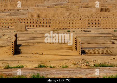 Row soil mud bricks place in open to drying. Stock Photo