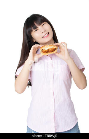 Beautiful Chinese American woman eating a Chicken Sandwich isolated on a white background Stock Photo