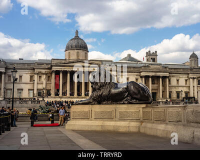London, United Kingdom: 12 May 2019: Tourists visit Trafalgar Square in London. The capital of UK is one of the most popular tourist attraction on Ear Stock Photo