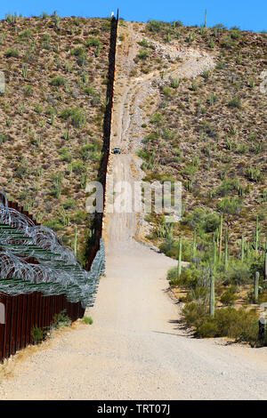 A quality assurance (QA) specialist with Task Force Barrier visited a portion of the Tucson Sector to do reconnaissance of the existing barrier June 8, 2019. The QA noted the presence of flash flood gates, access gates, harsh conditions, areas where the barrier had been cut and repaired, and steep grades, making some areas difficult to reach. Stock Photo