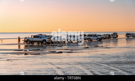 Broome, WA, Australia - Cars parked on the beach watching at sunset Stock Photo