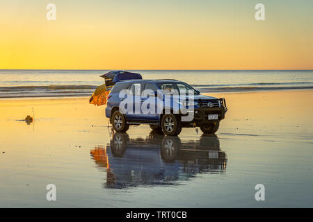 Broome, WA, Australia - Cars parked on the beach watching at sunset Stock Photo
