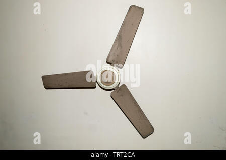 Antique and old electronic metal ceiling fan with three blades in vintage house Isolate on white background. Stock Photo