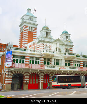 SINGAPORE - JANUARY 14, 2017: City bus stop by Central fire station building of Singapore Stock Photo