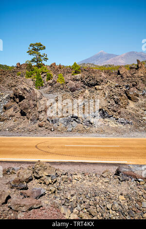 Road with Teide volcano in distance, Teide National Park, Tenerife, Spain. Stock Photo